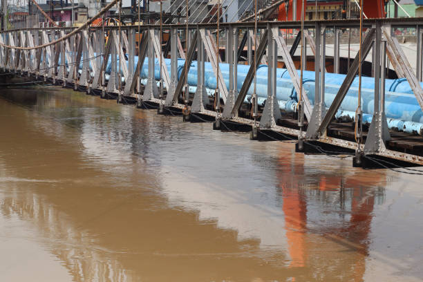 istock Truss frame to support the water pipe on the river. 2203904732