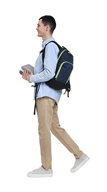 istock Young man with backpack and books on white background 2203910530