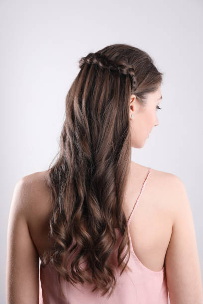 istock Woman with braided hair on light background, back view 2203912077