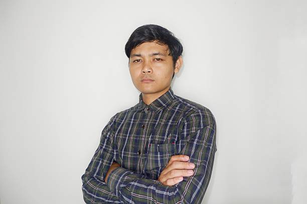 istock an Indonesian man is taking a selfie with a random expression and style and green shirt, self potrait 2203913360