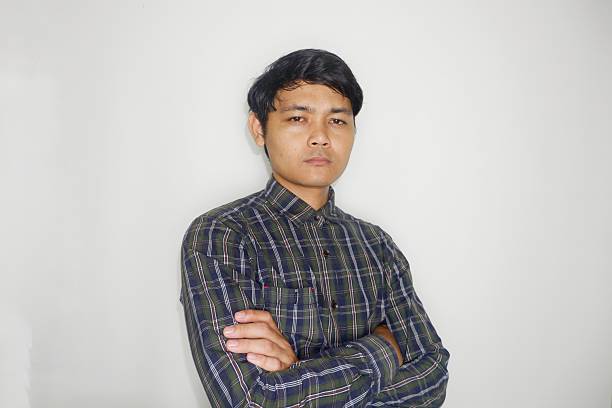 istock an Indonesian man is taking a selfie with a random expression and style and green shirt, self potrait 2203913388