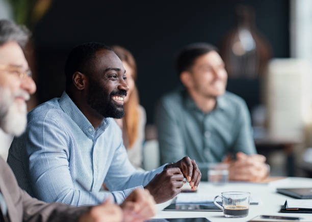 istock Smiling Professionals Collaborating During a Productive Business Meeting in a Modern Office 2203913893
