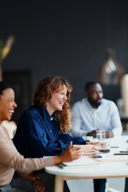 istock Group of Colleagues Collaborating in a Creative Work Environment 2203913908