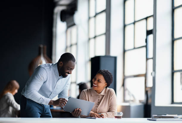istock Professional Team Discussing Ideas in a Modern Office Environment 2203913912