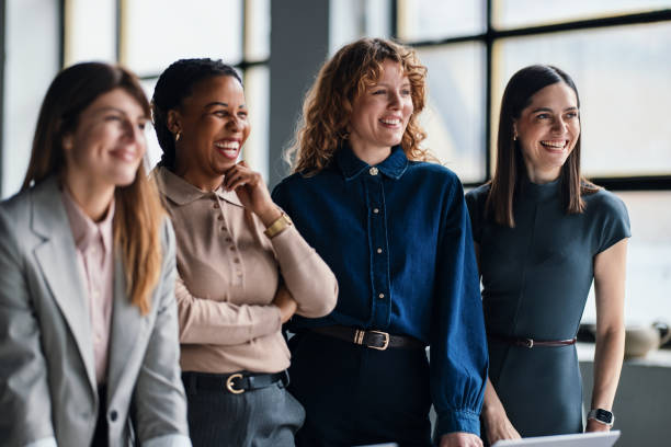 istock Group of Colleagues Smiling and Collaborating in a Modern Office Environment 2203913941