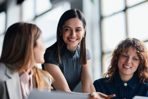 istock Smiling Colleagues Collaborate in a Bright Modern Office Environment 2203913945