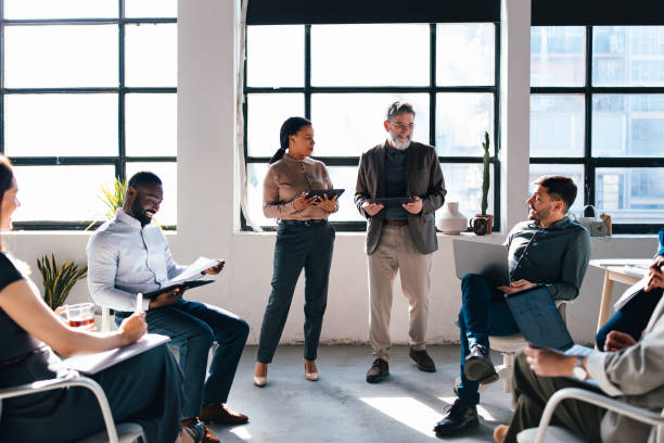 istock Diverse Group Conducting Teamwork Session in Well-Lit Modern Office Environment 2203913955