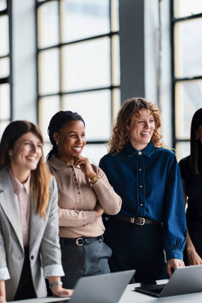 istock Group of Professionals Collaborating in a Modern Office Space 2203913966