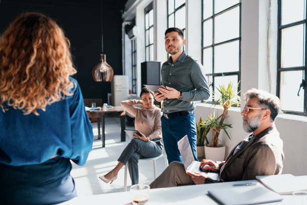 istock Business Team Discussing Ideas During a Modern Office Meeting 2203913974