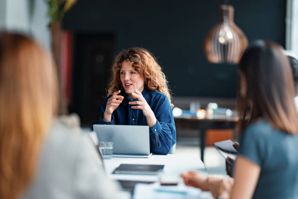 istock Diverse Team Engaged in a Discussion During a Professional Business Meeting 2203913998