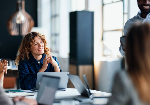 istock Team Meeting in a Modern Office Environment with Professionals Collaborating 2203914010