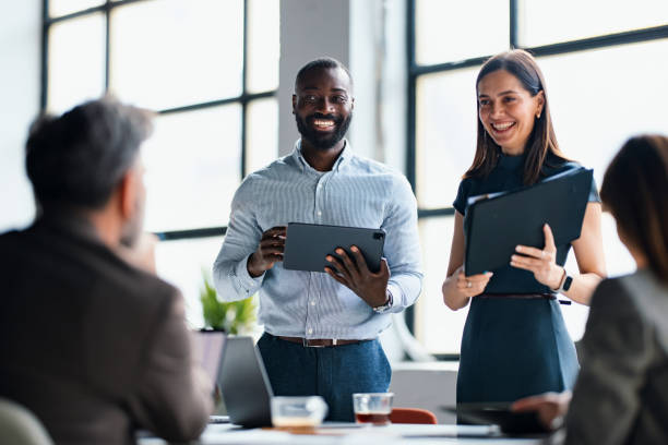 istock Professional Team Presenting Ideas During Business Meeting in Modern Office 2203914012