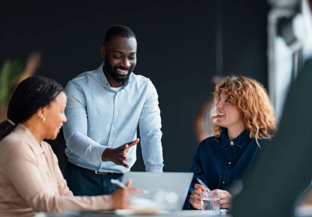 istock Colleagues Collaborating During a Business Meeting in a Modern Office Setting 2203914023