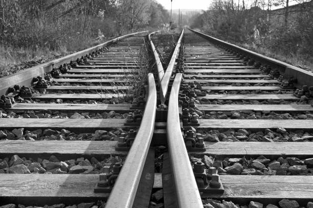 This photo was shot on an undisclosed industrial park of Dusseldorf, Germany in late April 2025, Depicting on an abstract way, the partial view of a railroad junction module in a state of disrepair.