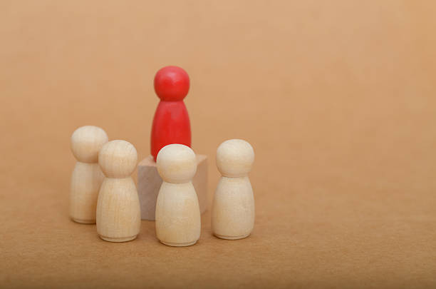 istock Red Leader Standing Tall: Business Leadership and Teamwork Concept 2203917301