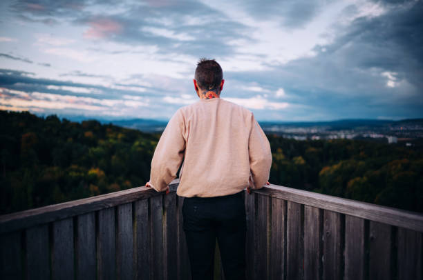 About being one with nature Man standing on watch out in Sunset feeling could air on skin