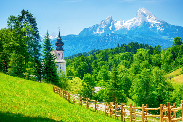 Pilgrimage Church Maria Gern (Wallfahrtskirche Maria Gern) and Watzmann mountain on background in Bavarian Alps, Berchtesgaden