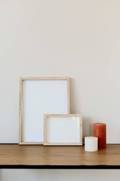 istock Minimalist decor with wooden frames and vase on console coffee table 2203932210
