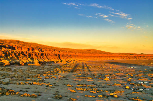 istock Fiery red eroded rocks at sunset at a remote coast in Western Australia 2203933275