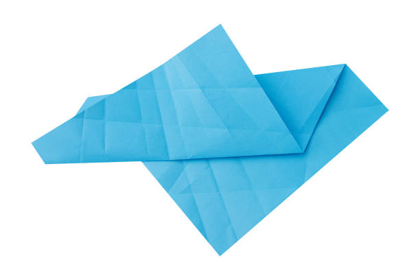 Abstract origami blue crumpled paper isolated on white background