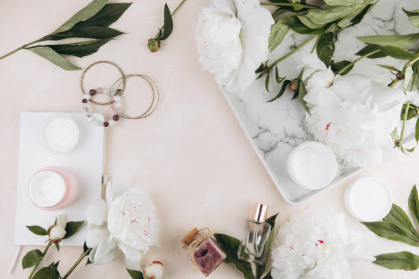 istock Beauty composition with women's objects and peony flowers, cosmetics, perfumes, jewelry. 2203935849