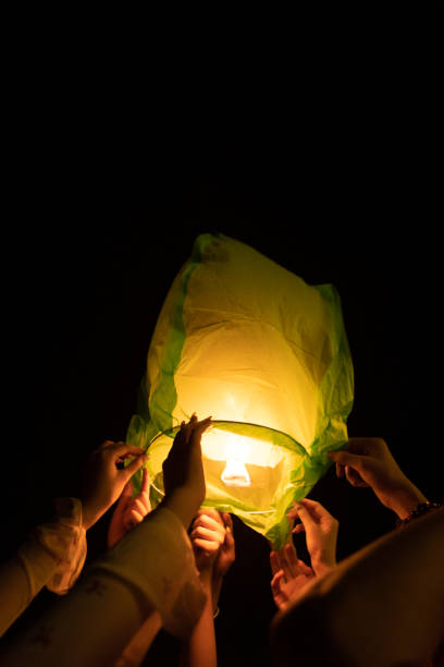 istock Chinese Kongming lanterns pray for blessings, crowds gather together 2203939484