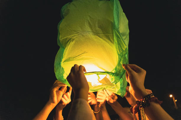 istock Chinese Kongming lanterns pray for blessings, crowds gather together 2203939493