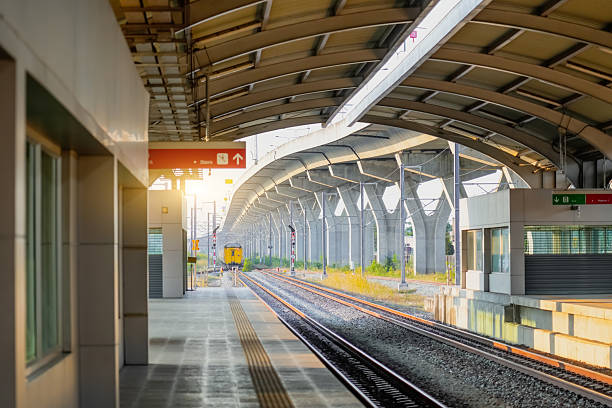 istock Empty passenger platform at a train departure far away station awaiting of a commuter electric train. 2203941640