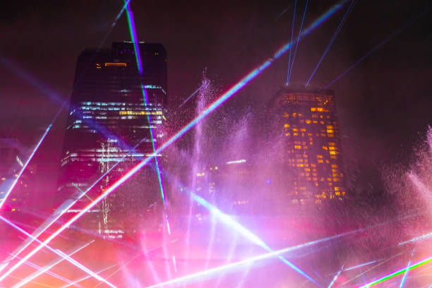 istock Skyline shining at night with light beams many laser beams abstract frame shot 2203942251