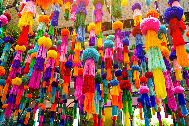 istock Decorations hanging colored jellyfish made from woolen threads and pompom balls suspended on the ceiling 2203942561