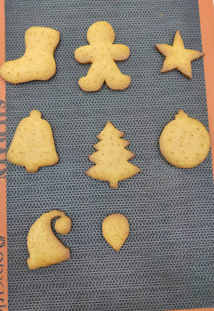 Christmas-Themed Cookies on Textured Mat