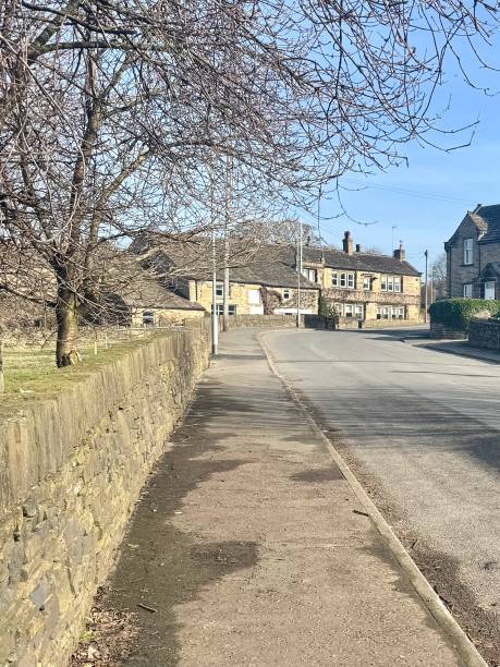istock Quiet Road in an English Village 2203946557