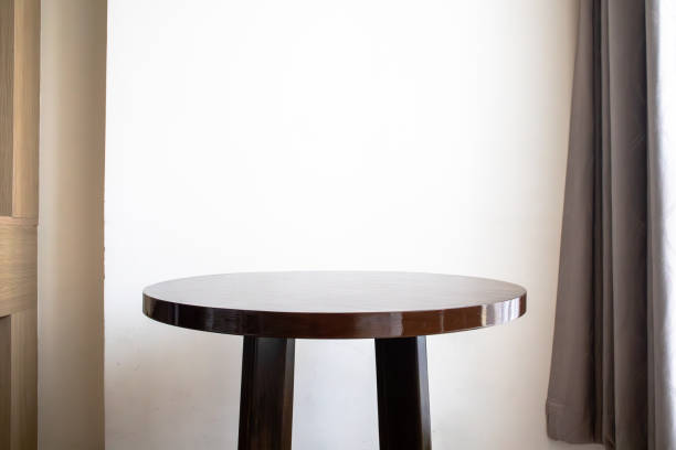 Book on wooden coffee table near sofa in living room