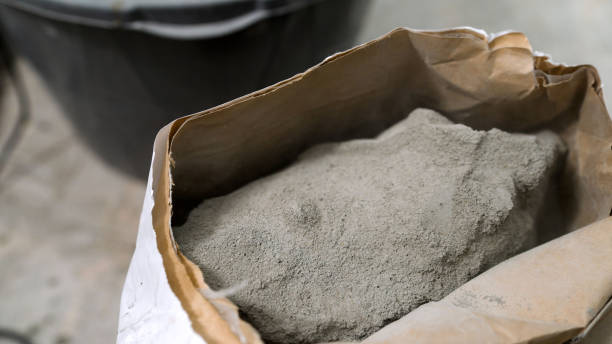istock Open sack of dry cement mix for construction industry. 2203953796
