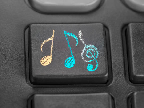 Close-up of push button with musical notes drawn with colored chalk