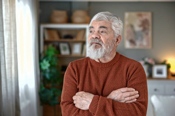 istock A pensioner sits at the dining room table and works on a tablet 2203959940