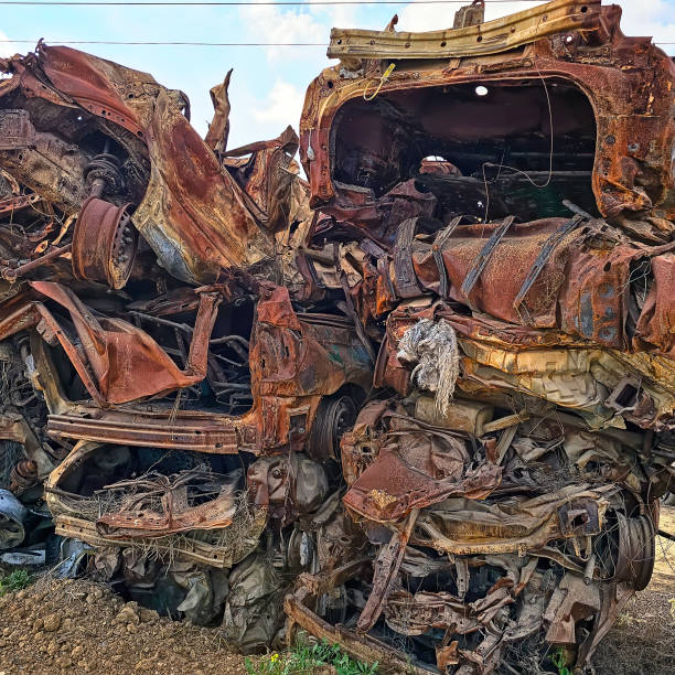 Catarroja, Valencia, Spain - November 19, 2024: The resulting after effects of Storm DANA. Major clean up underway, removing cars from town centre and stacking on the road