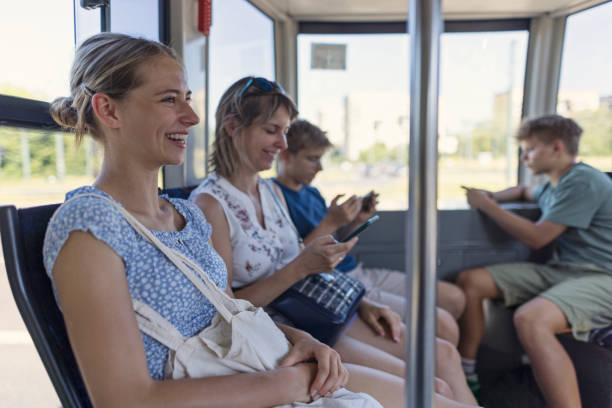 istock Family commuting in the city by a modern tramway. 2203961370