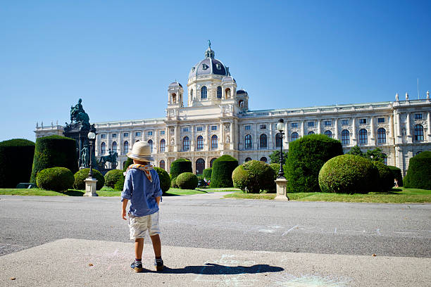 Vienna, Austria. September 9, 2021. A kid standing in front of the Vienna Art History Museum