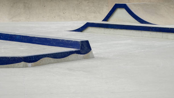 istock Unique skate park features with blue ramps and smooth surfaces for skaters 2203962673