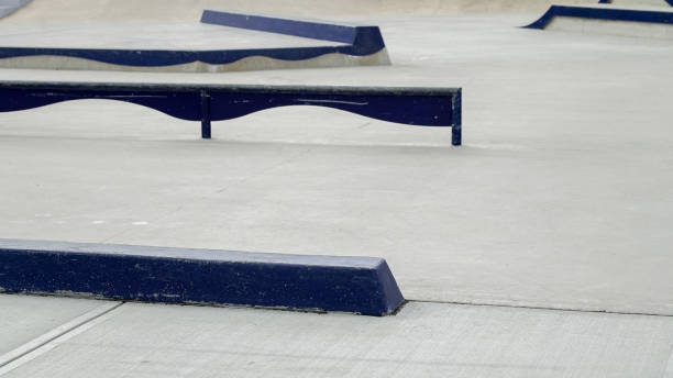 istock Unique skate park features with blue ramps and smooth surfaces for skaters 2203965092