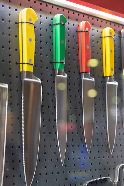 istock Colorful kitchen knives displayed on a pegboard in a modern kitchen 2203965560