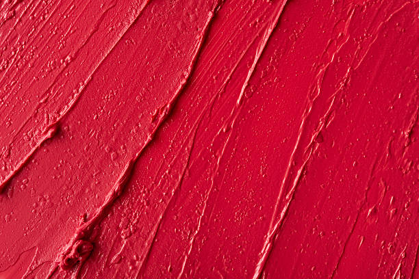 istock Closeup of red glossy lipstick texture with smooth strokes and rich pigmentation 2203966599