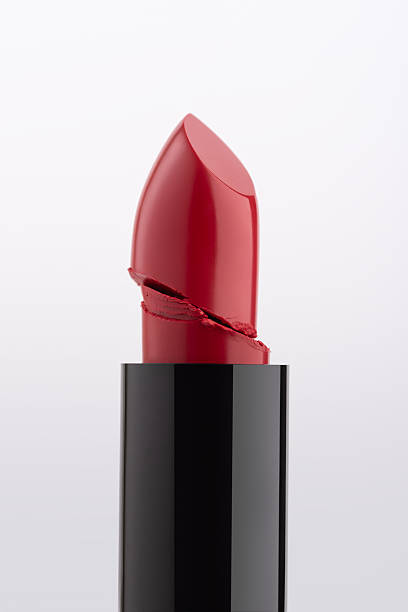 istock Closeup of a broken red lipstick bullet with a smooth, glossy texture 2203966685