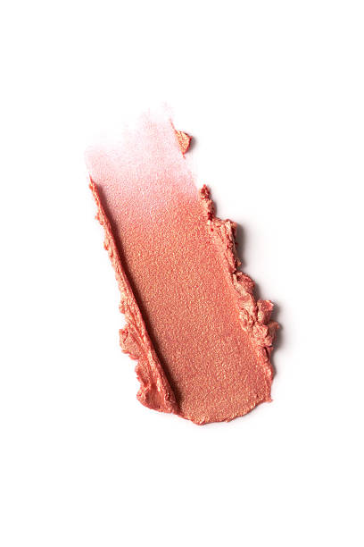 istock Closeup of a broken rose gold lipstick bullet with a smooth, glossy texture 2203966829