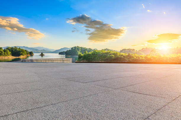istock Empty square floor and lake with mountain scenery at sunset 2203968589