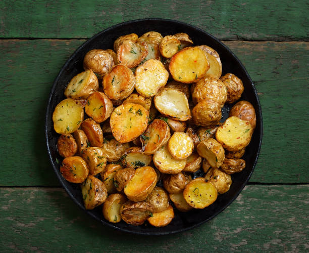 istock Roasted potato on plate, vegetarian food 2203969642