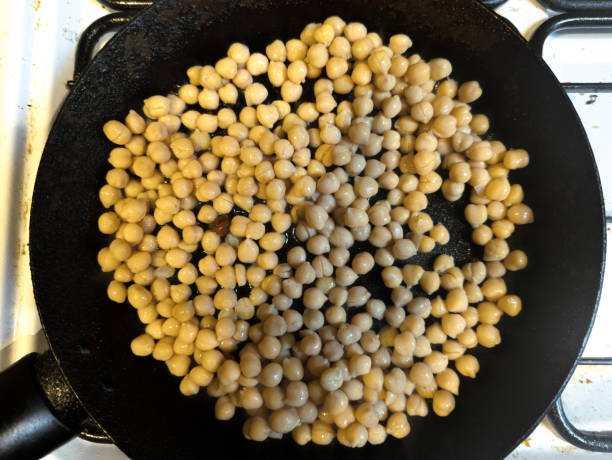 istock Chickpeas frying in a pan 2203974911