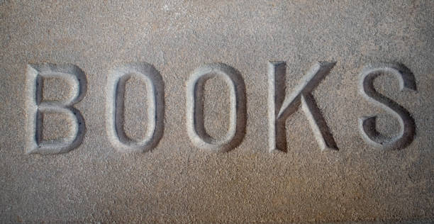 Close-up of stacked books. The focus is on the centre of the picture.