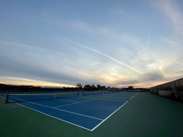 istock Tennis Courts at Dusk with Clouds 2203977878
